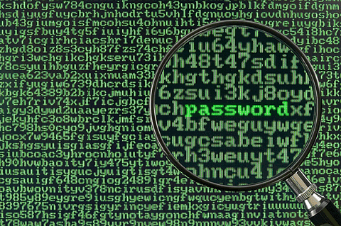 Encryption password security concept with magnifying glass over green code background, emphasizing cybersecurity and data protection keywords.